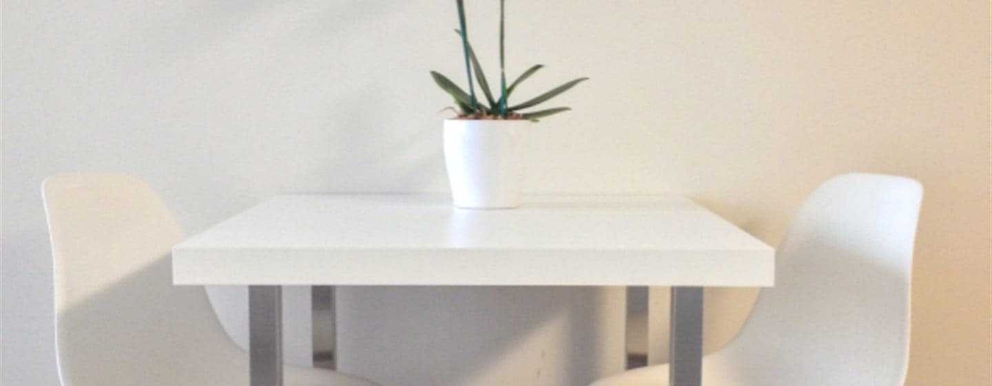 A clean, minimal dining space in a tidy home